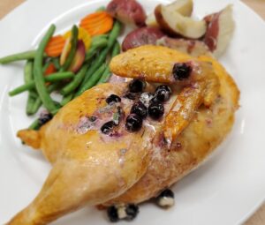 Roasted Chicken with a blueberry sage butter